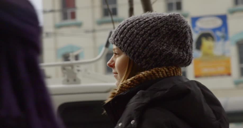 Woman walking through the city in the winter