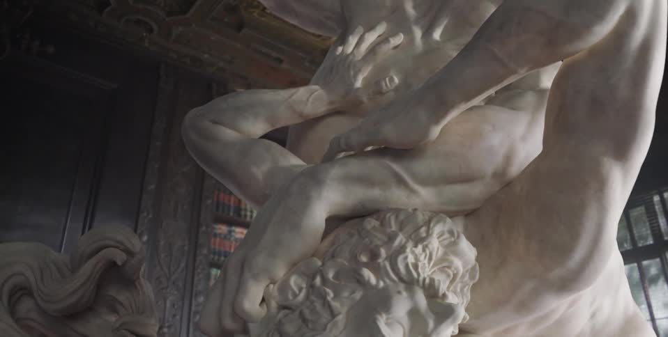 The statue of men fills the room