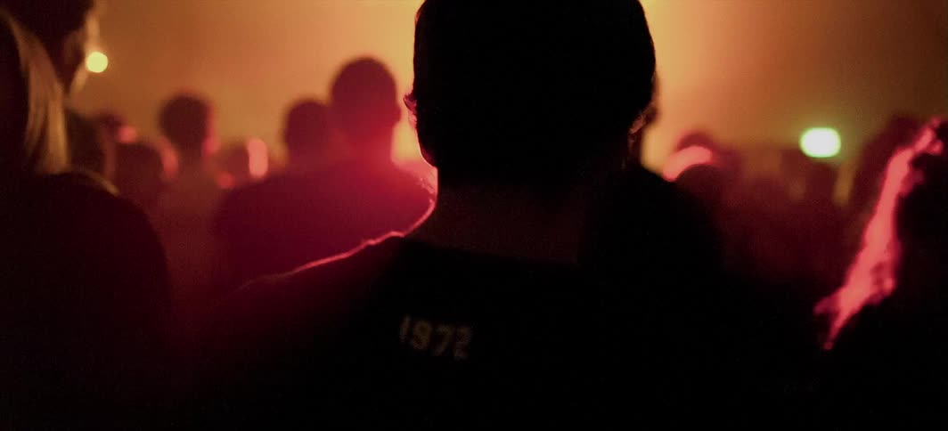 People dance at a concert
