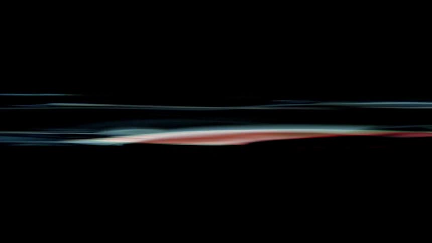 Lights shine in two bands against a black background