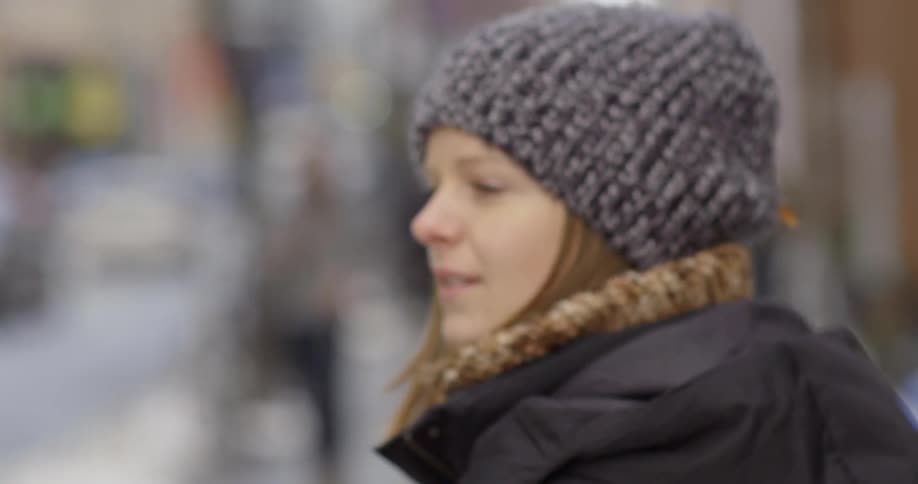 Woman looks around on a street
