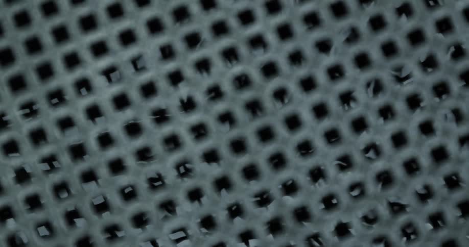 Water flows beneath a metal grate