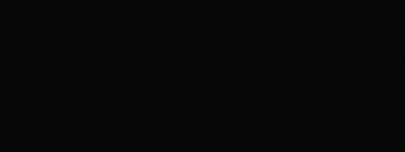A man shadow boxes with a strobe light flashing