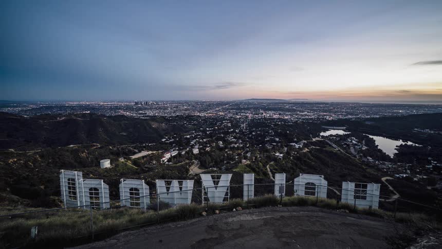Clouds float above the hollywood sign at sunset