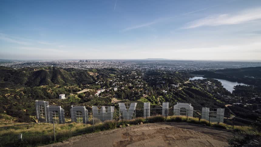 The back side of the hollywood sign on a hill