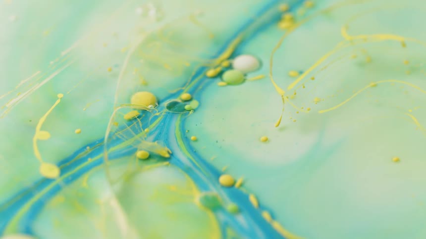 The ink is swirled together in the water