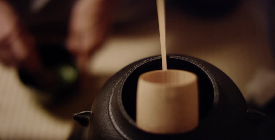 A person mixes something in the bowl