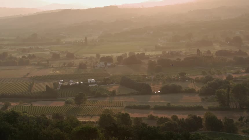 Sun shines down over flat plains and farmland