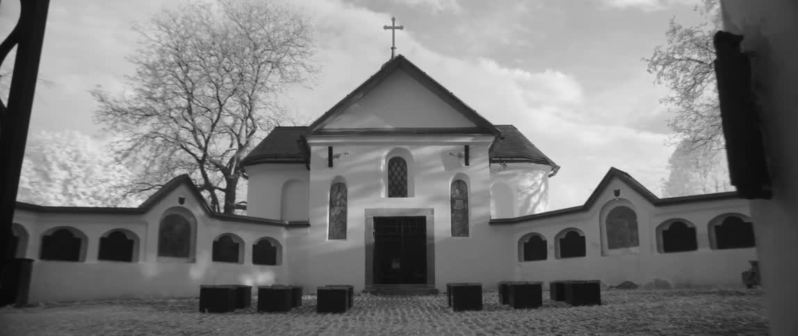 A church with a courtyard in front
