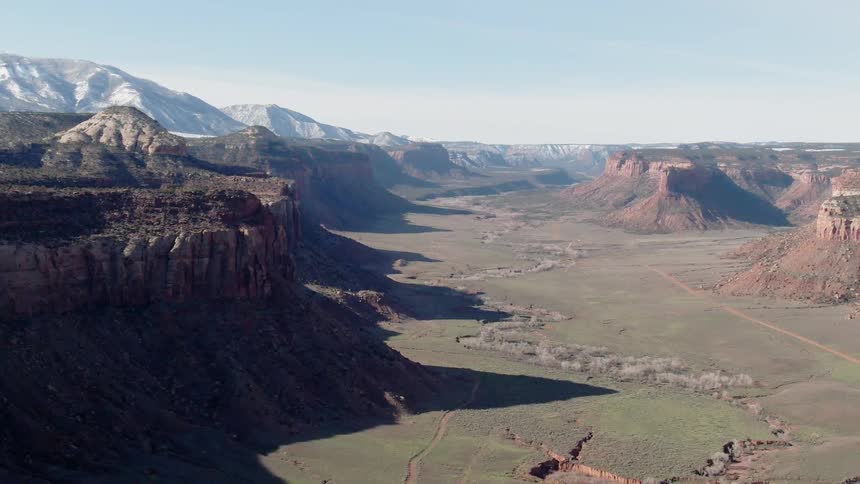 The grass is green between the canyon