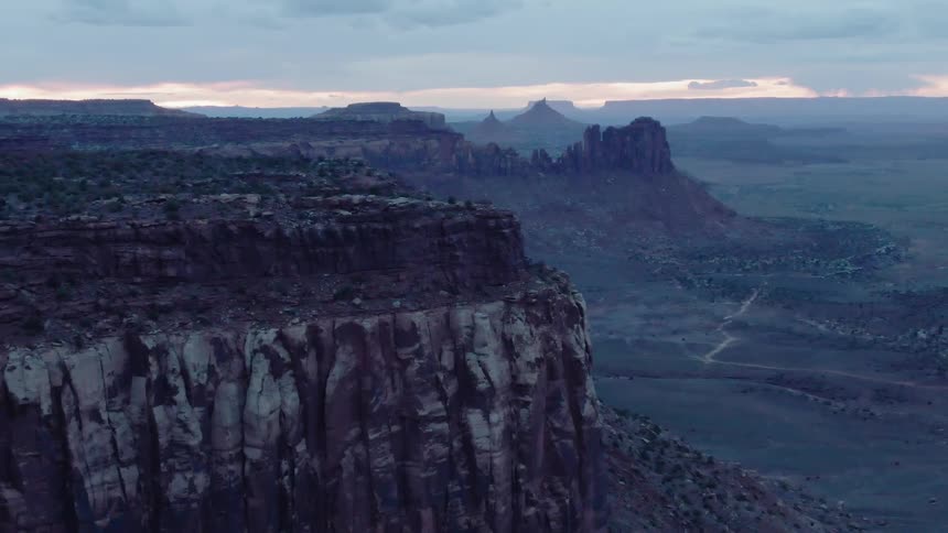 Tall canyon walls tower in the landscape