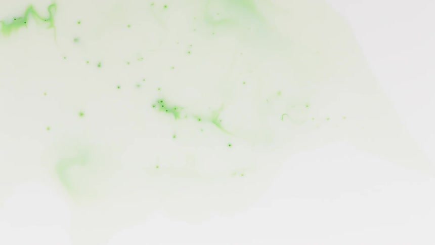 Green ink moves in the water