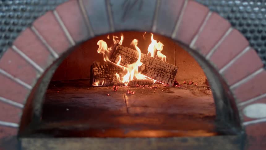 The logs in the chimney are on fire