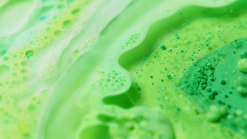 The green ink is spinning in the water