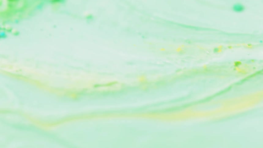 Yellow liquid swirls in the blue liquid