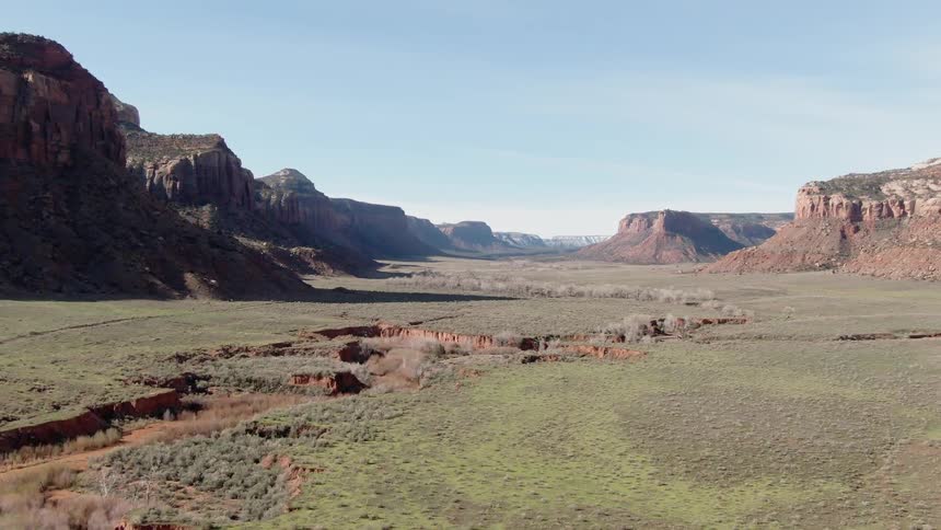 Grassy valley surrounded by plateaus