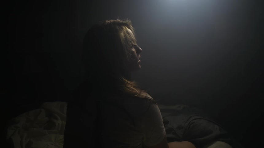 Light shining down on a woman