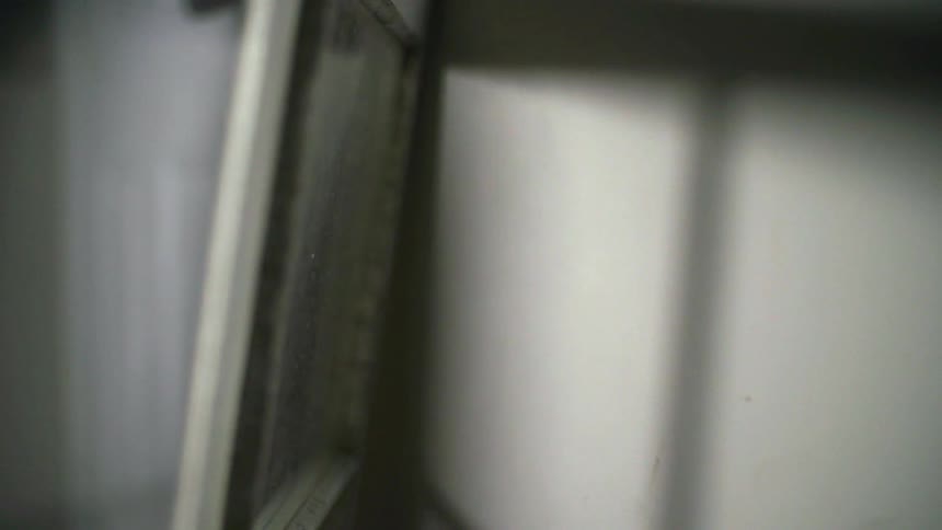 Shadows and light entering a window and reflecting off a wall