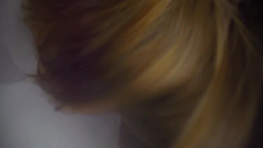 Persons long hair whipping around in slow motion