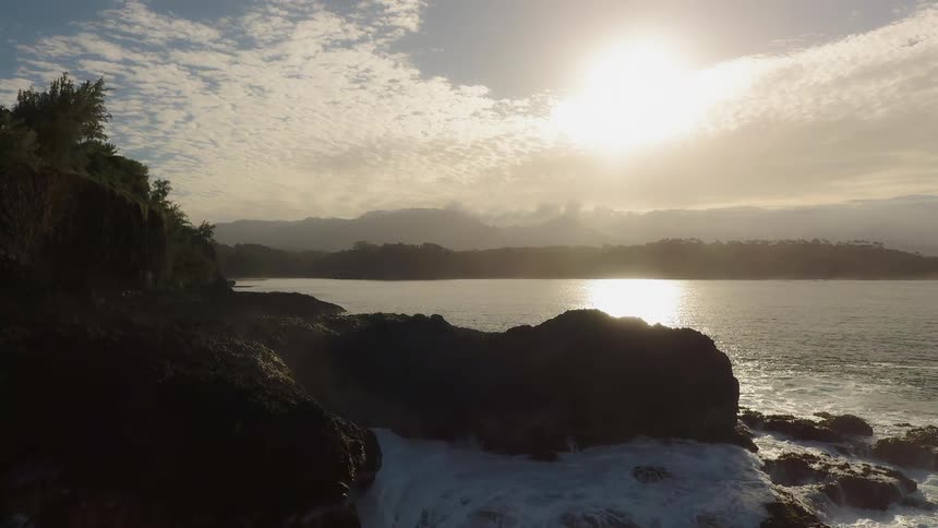 The bright sun shines on the calm lake