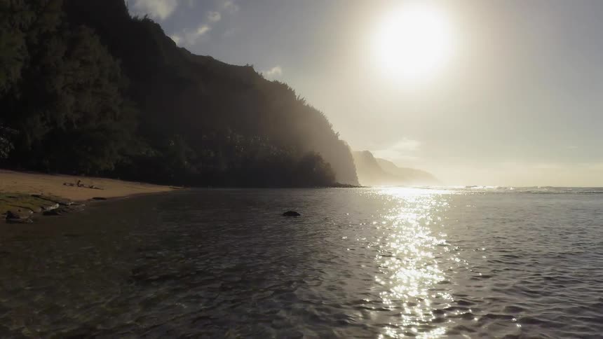 The sun shines on the ocean water