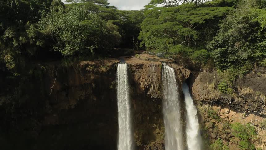 The waterfall has three streams going from the cliff