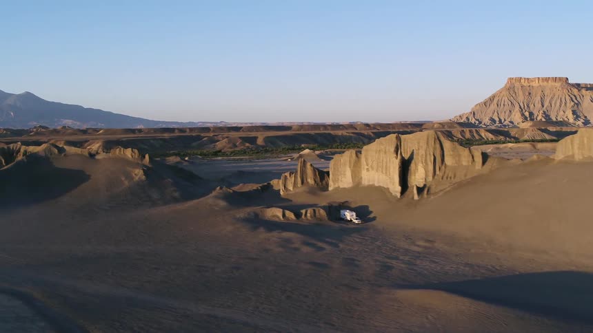 Rock formations stand in a desert