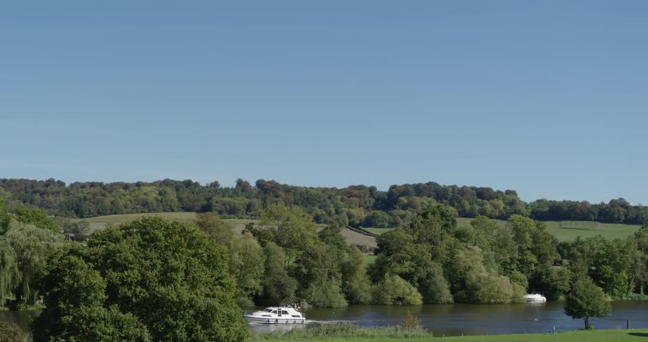 A boat floats on a rural river