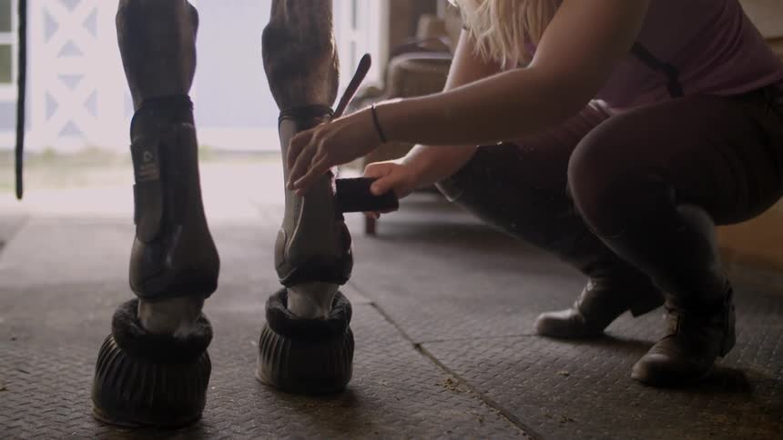 Woman wrapping something around a fake leg