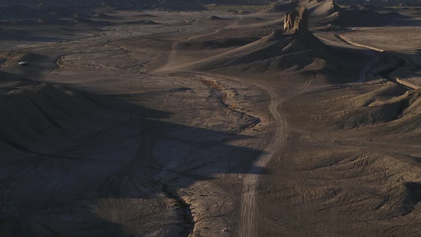 Shadows in a sandy hilly desert