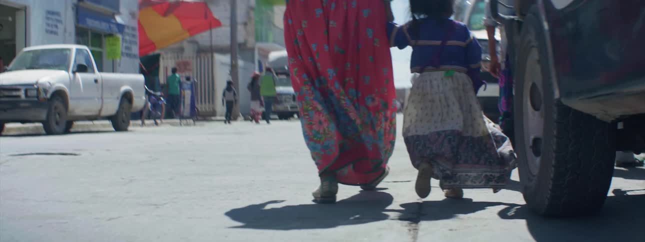 A family walks on a city street