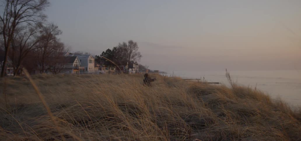A child is running near the shore