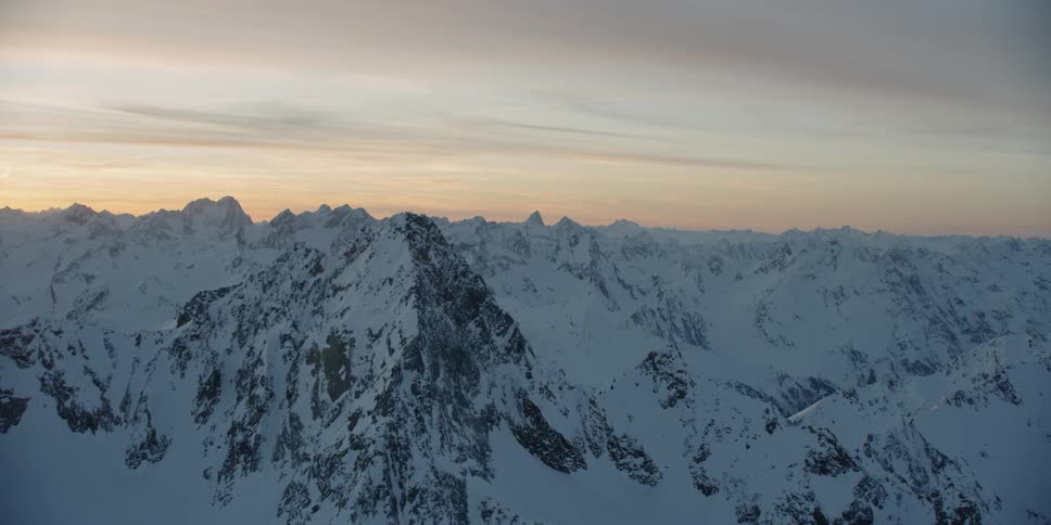 The sky is covered with clouds near the mountain range