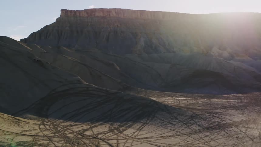 The sun is bright above these mountains