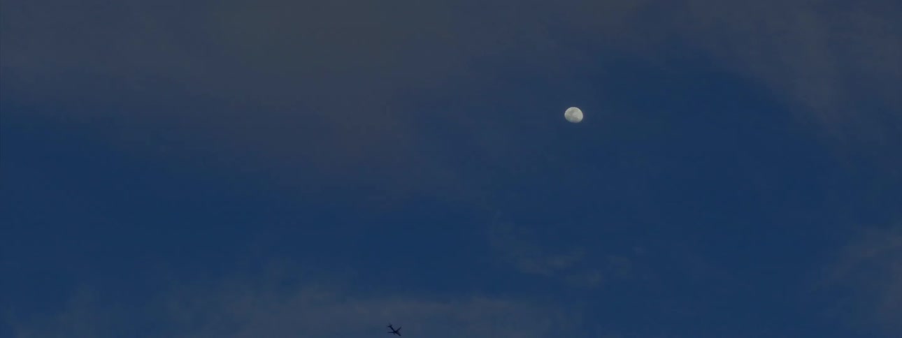 Airplane flies downwards at night