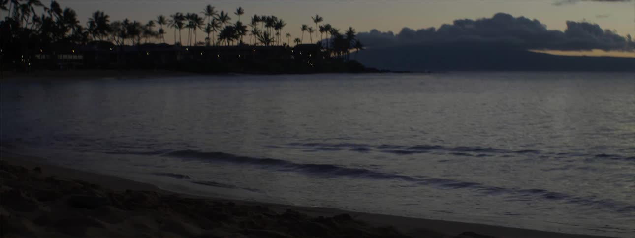 The tide flows onto the beach shore