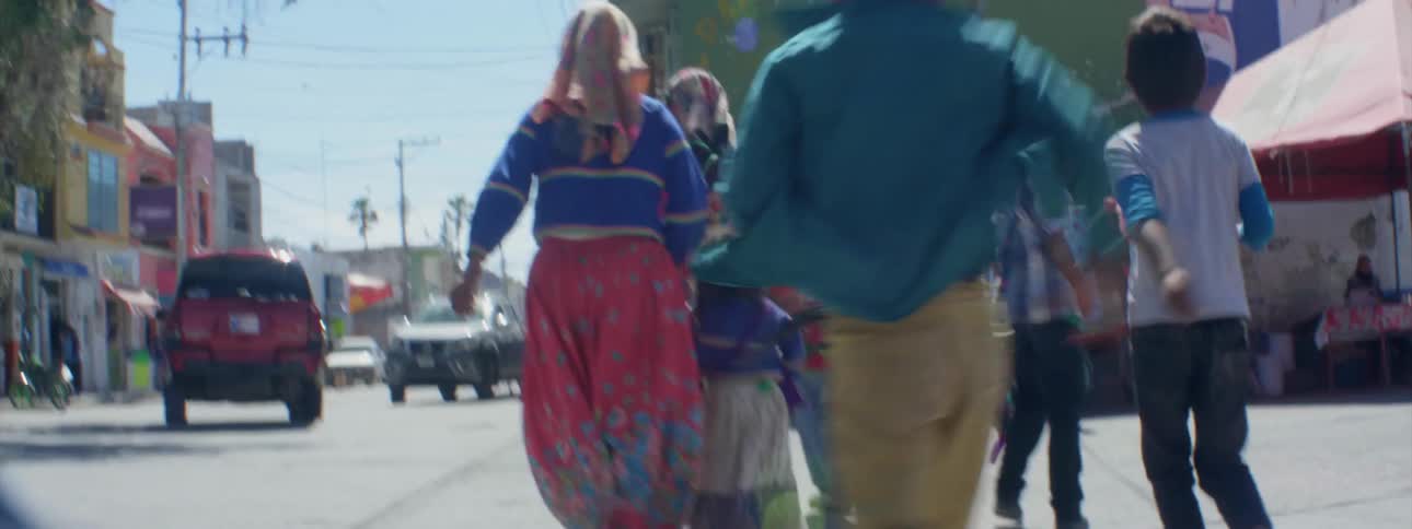 A family crosses a city street