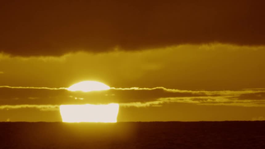 The sun is quickly setting in the distance