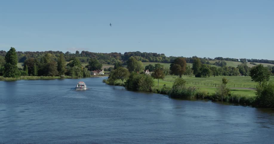 A ferry boat travels down the canal
