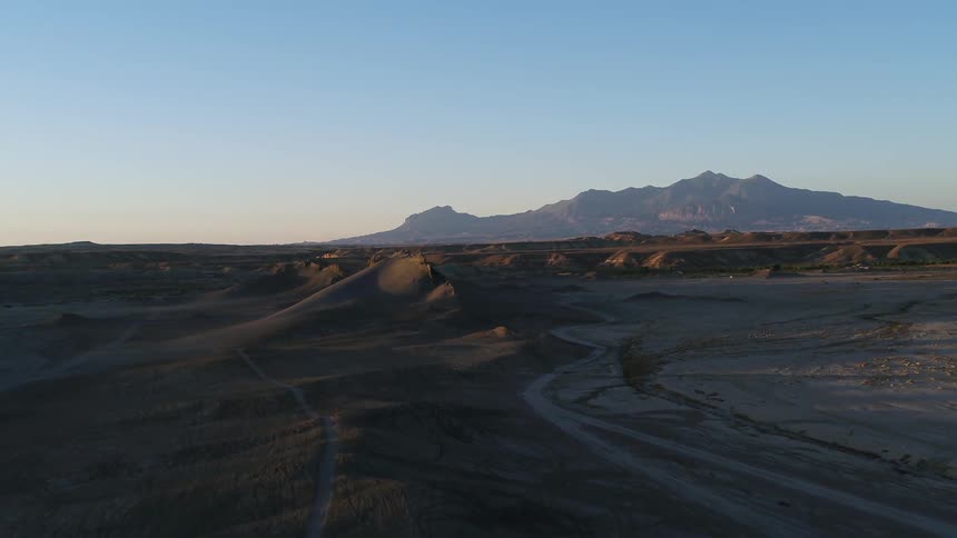 The hills go into the distance before the mountain