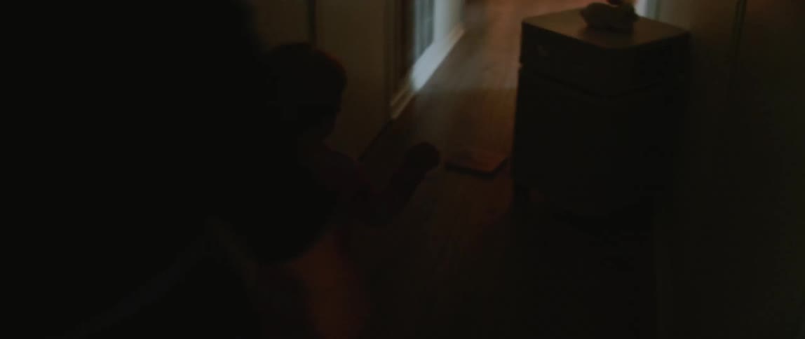 Woman and baby walk in a hall at home