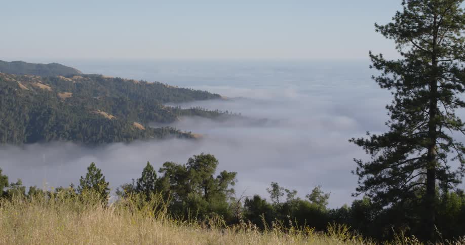 The clouds can be seen over the hills below