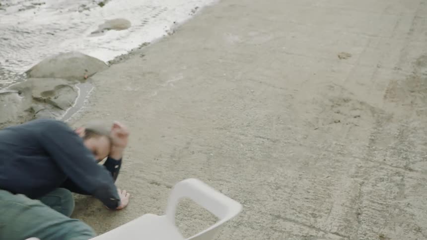Man is hit in the face with a water jug