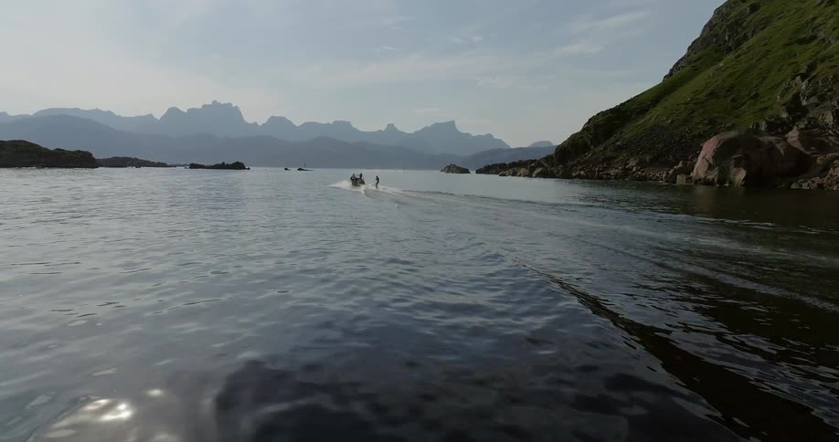 A boat floats on a mountain lake