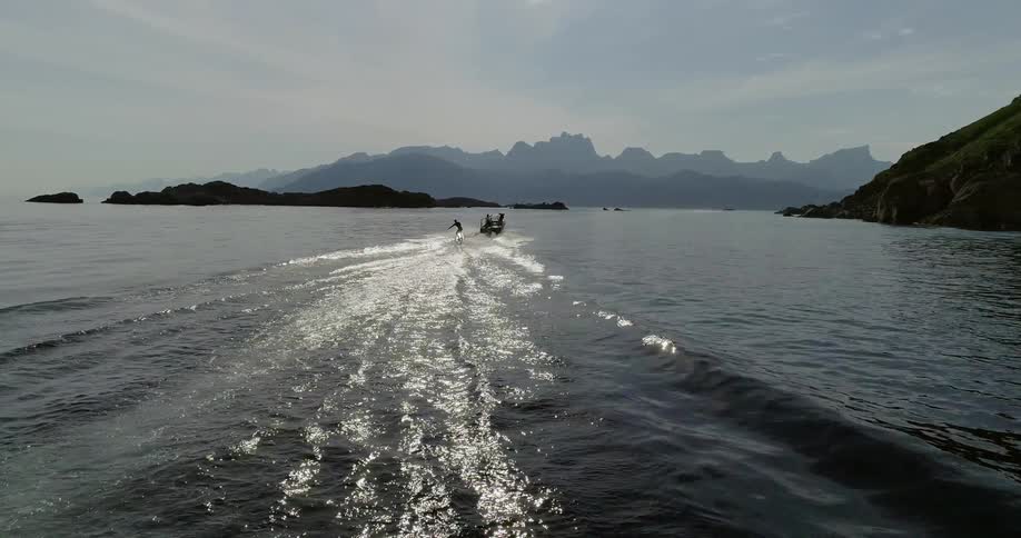 A boat is pulling a skier behind it