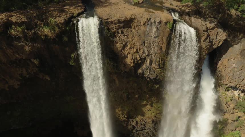A flowing waterfall on a sunny day