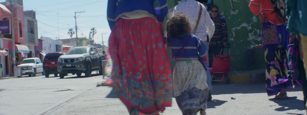A family crosses a city street