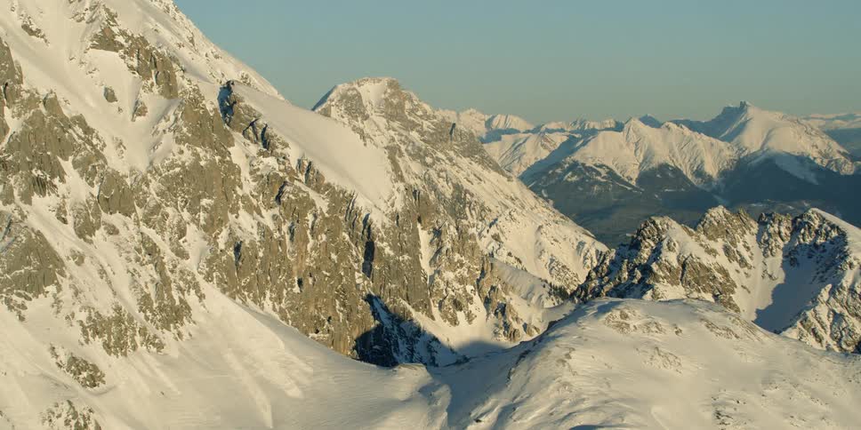 The mountains are covered with thick snow