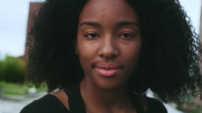 Woman slowly looks up smiling