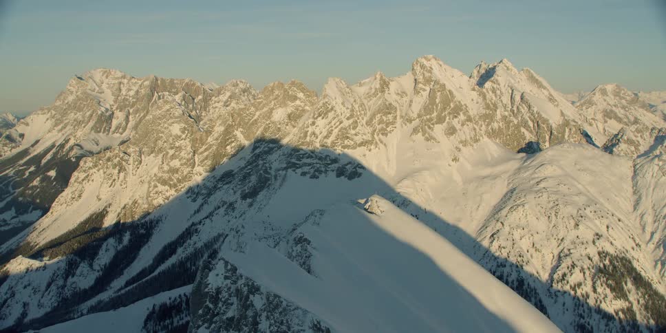 Snow covered mountains and a clear blue sky